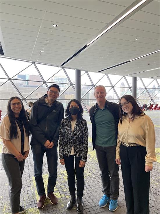 Ian Roe (fourth from left) stands with Theresa Tam and the KBI team