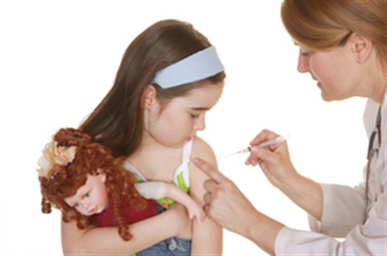 nurse immunizing girl